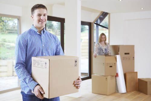 Removal team loading boxes during a house move in Hornsey