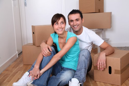 Packed boxes and furniture being moved by removals van